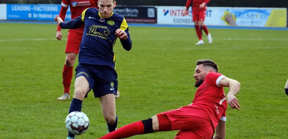 Player tackling on the field during match