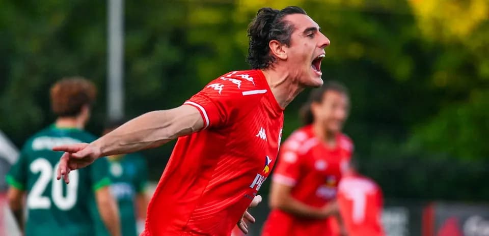 Player celebrating goal in Larne match