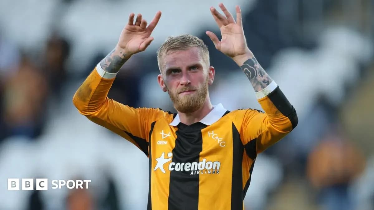 Player celebrating and waving to fans after match