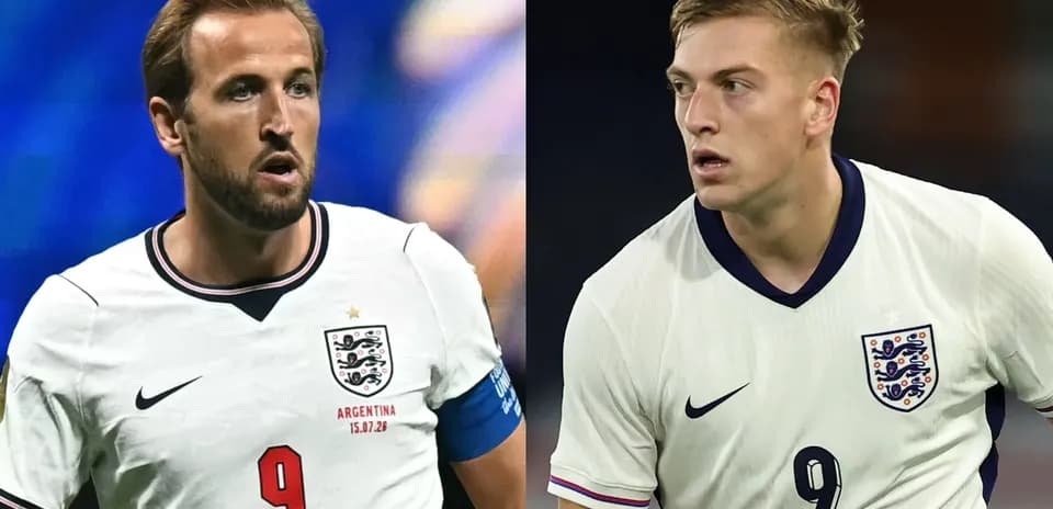 Two England players in white kits during match