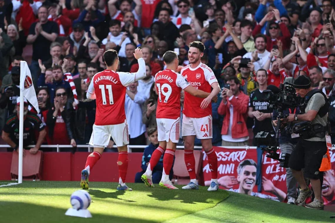 Arsenal players celebrating a goal at home