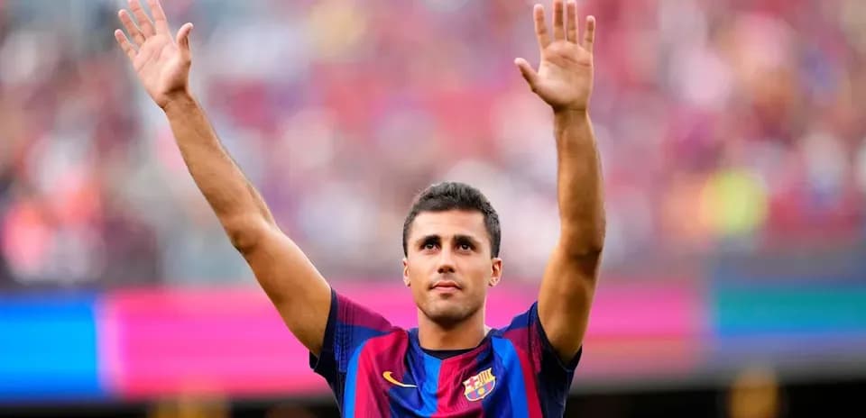 Player waving to fans at stadium