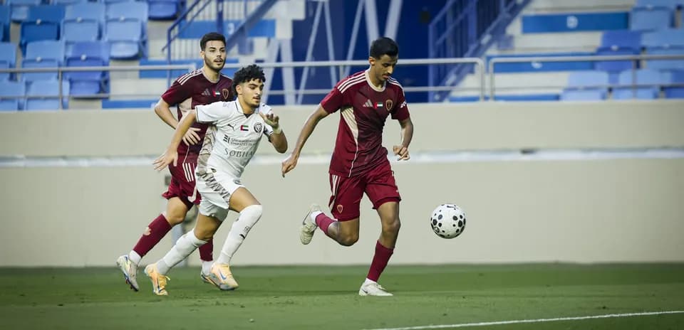 Players competing for the ball during U23 match