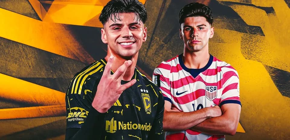 Two soccer players posing in team jerseys