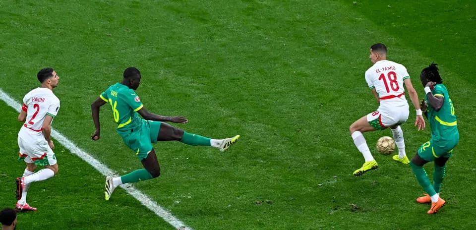 Players contesting the ball during a football match
