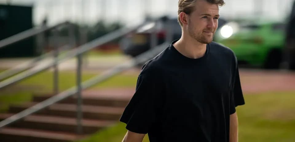Player walking towards the training ground entrance