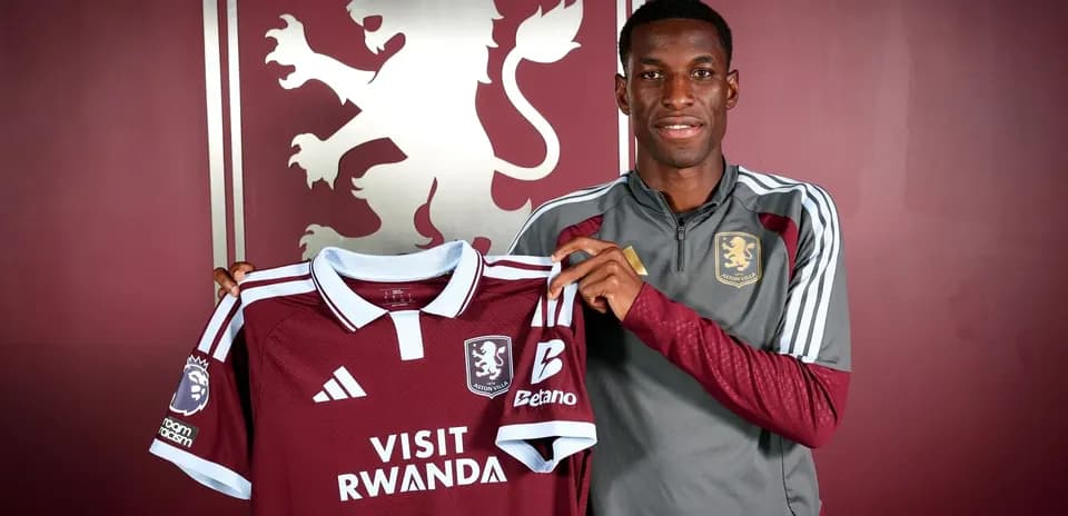 Player holding Aston Villa jersey in press room