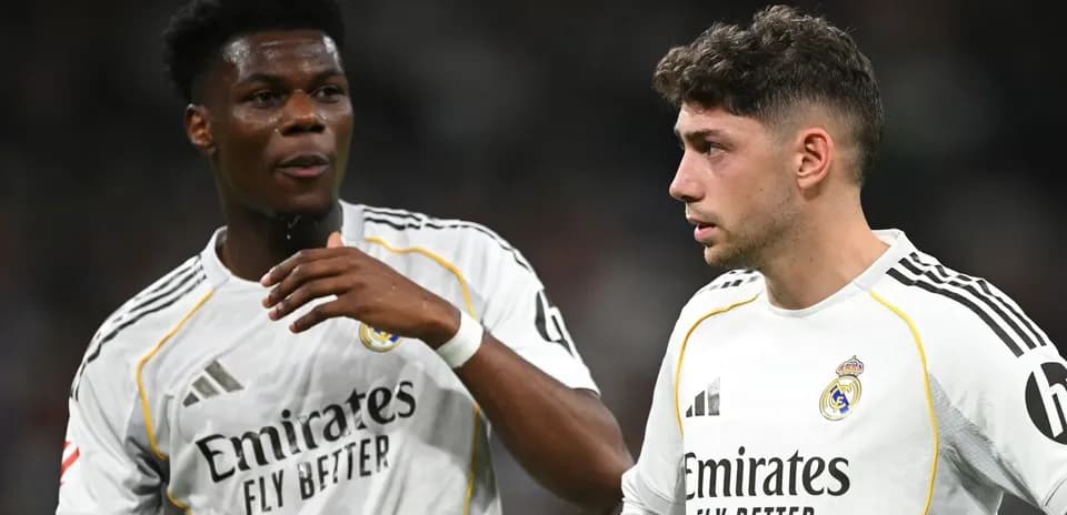 Two Real Madrid players discussing on the pitch