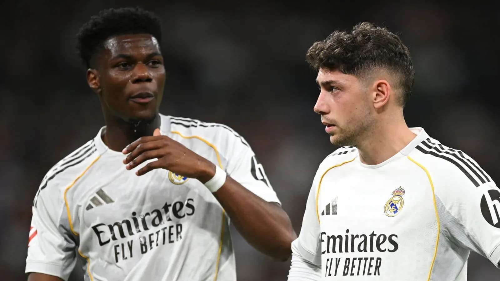 Two Real Madrid players discussing on the pitch