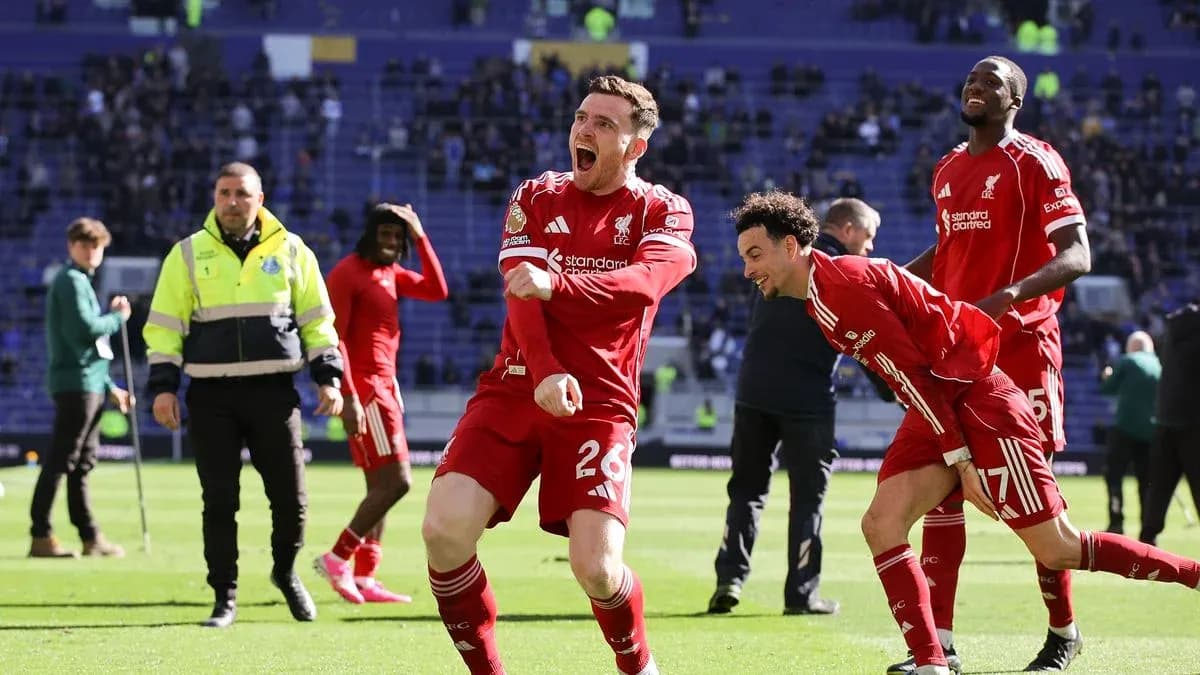 Liverpool players celebrating on the pitch after match