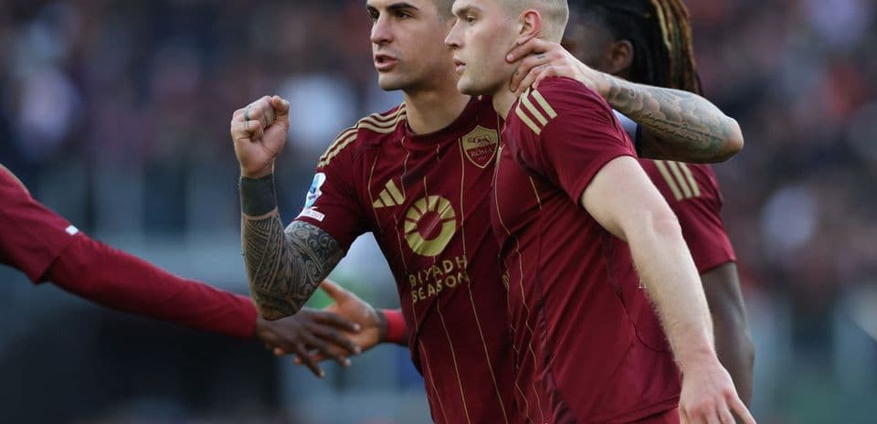AS Roma player celebrates a goal against Cagliari.
