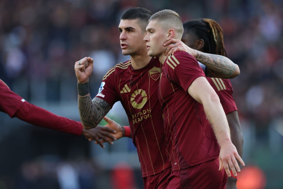 AS Roma player celebrates a goal against Cagliari.