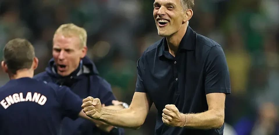 Coach celebrating with staff after match victory