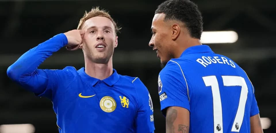 Two Chelsea players celebrating on the field