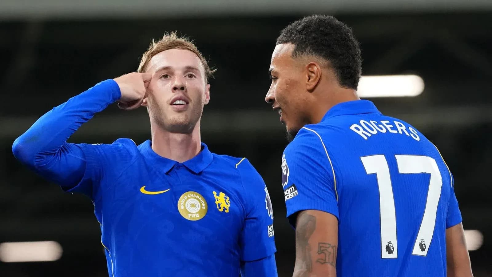Two Chelsea players celebrating on the field