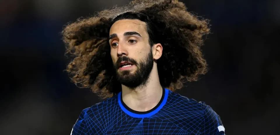 Player with curly hair in Chelsea kit
