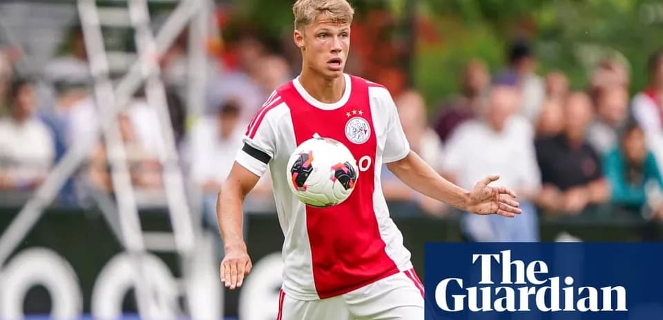 Player in Ajax kit controlling the soccer ball