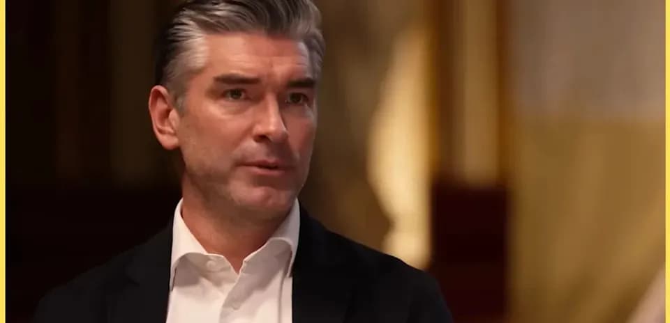 Man speaking in a formal interview setting