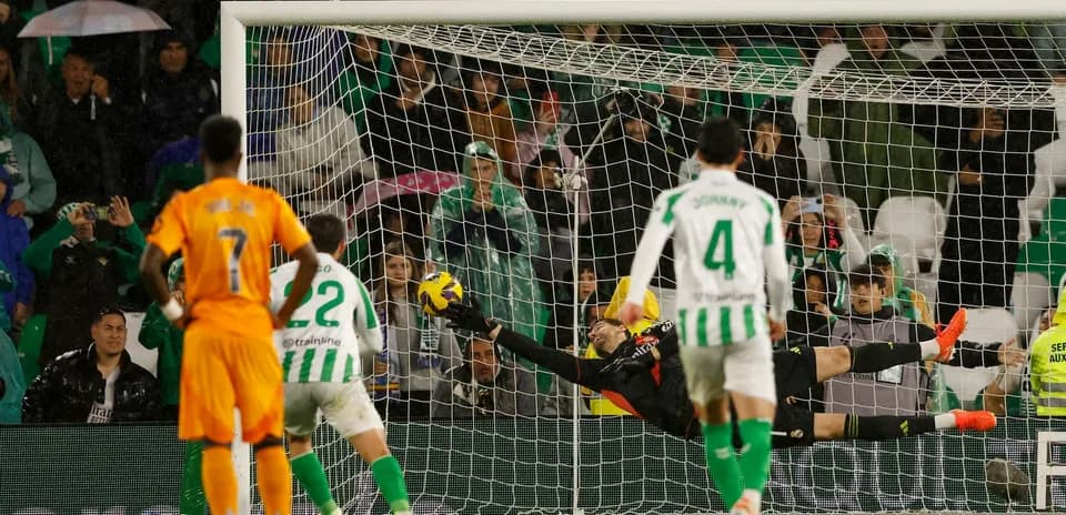 Goalkeeper making a save during Betis vs Madrid match