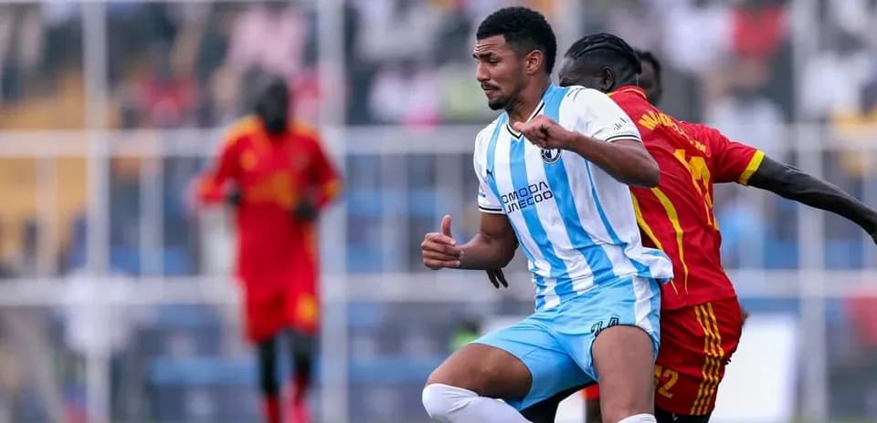 Player challenging for the ball during match