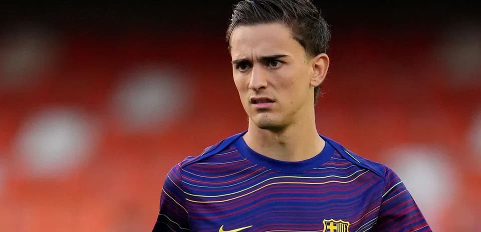Player wearing FC Barcelona training jersey on field