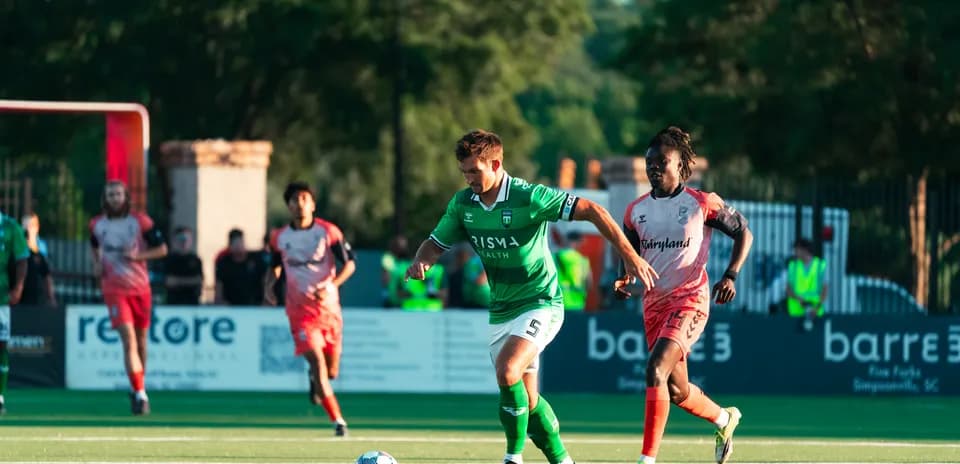 Player dribbling the ball during USL match