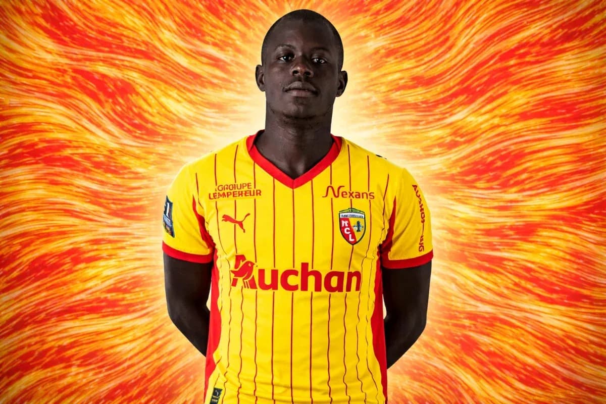 Player in yellow and red football jersey posing