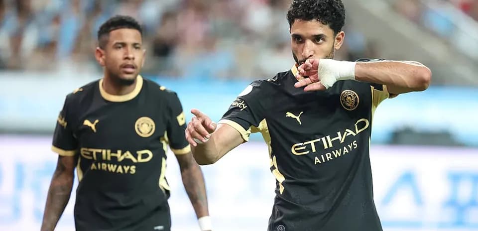 Player celebrating a goal during match with teammate