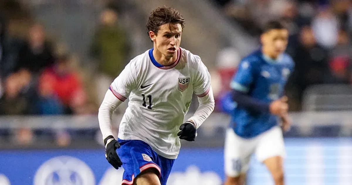 US player dribbling during international soccer match