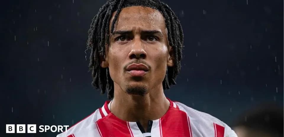 Brentford player in rain during match