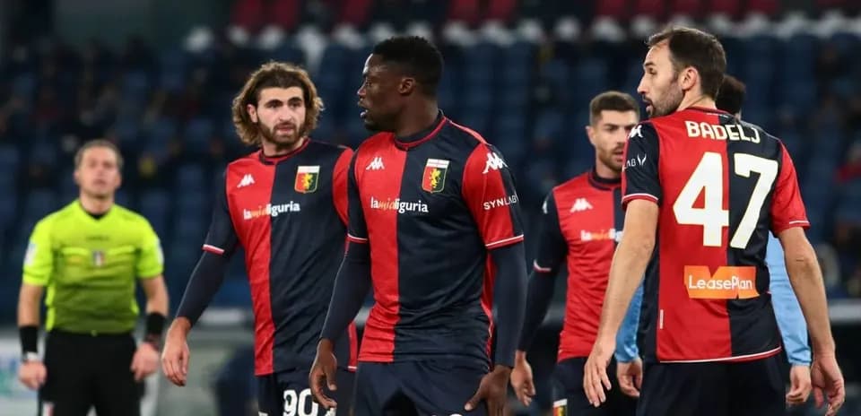 Genoa players discussing during a match