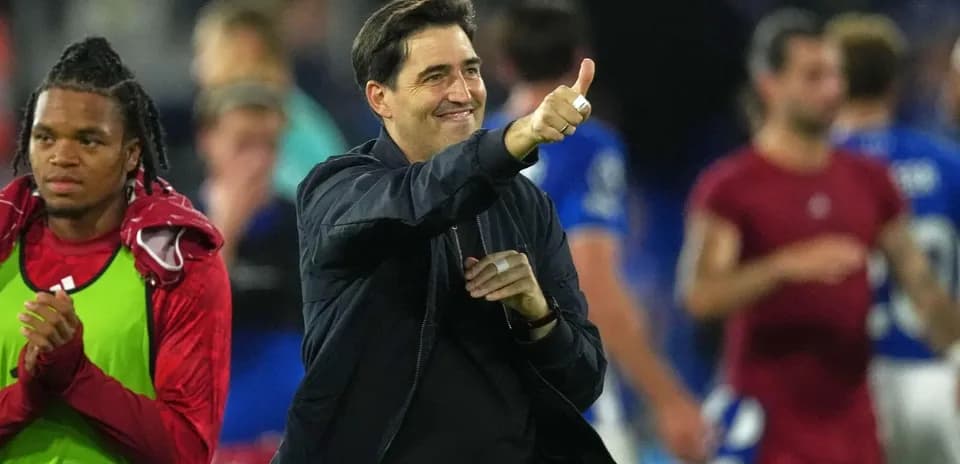 Coach celebrating with thumbs up after match