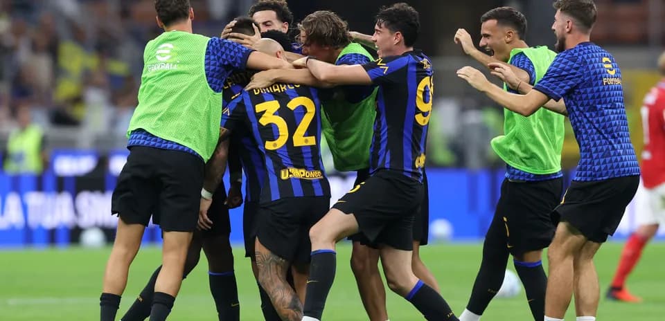 Players celebrating a goal on the pitch