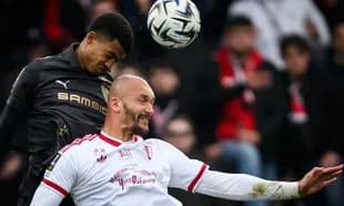 Two players contesting for a high ball during match