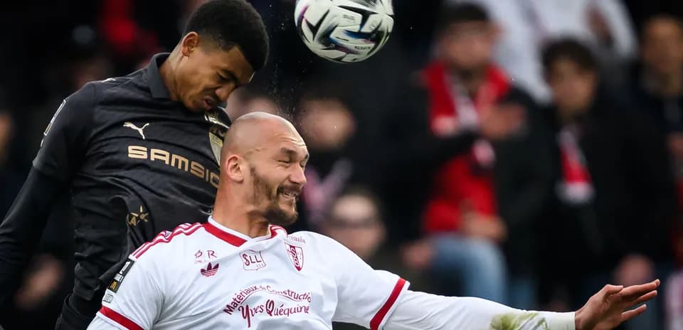 Two players contesting for a high ball during match