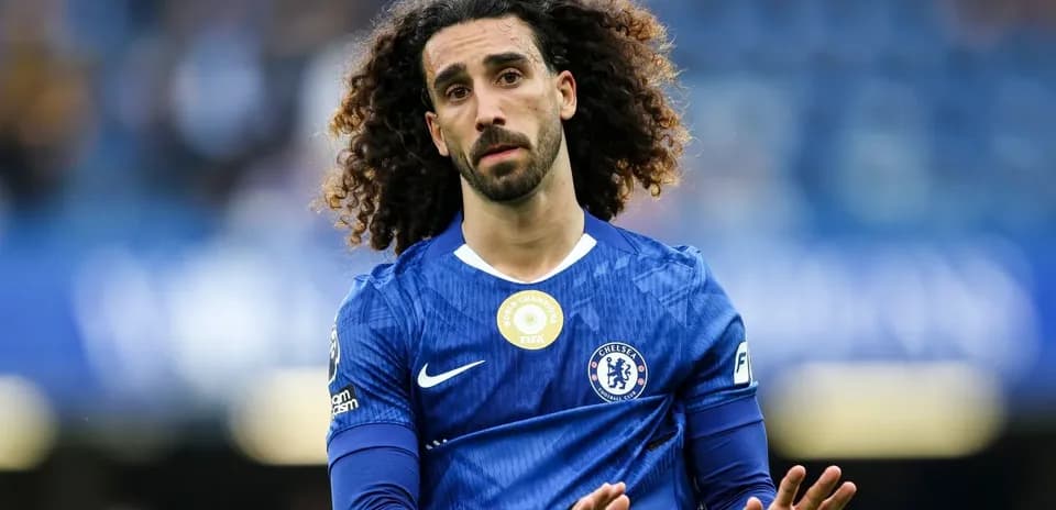 Player in blue Chelsea jersey gesturing on field