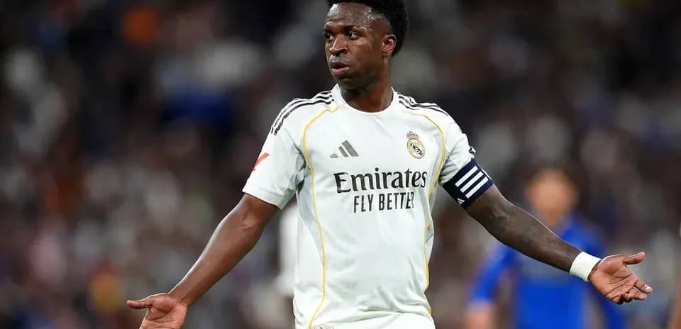 Player in Real Madrid kit gesturing during match
