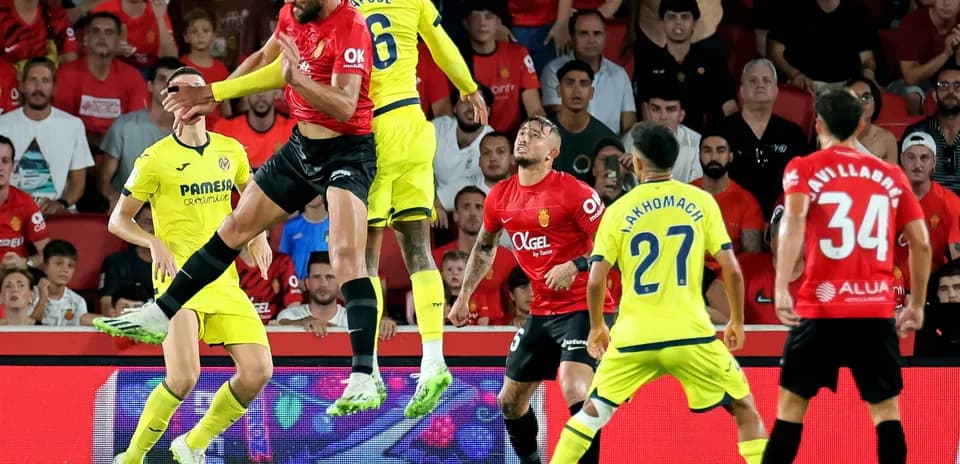 Players contesting a header during Mallorca match