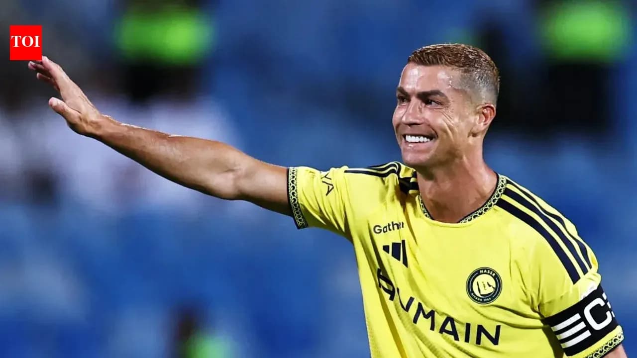 Player celebrating and waving to fans during match