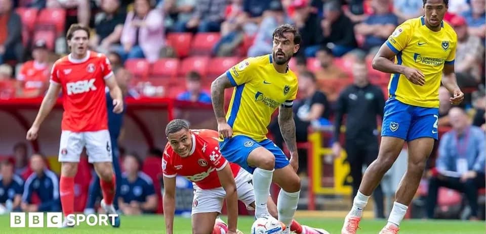 Players from Portsmouth and Charlton during match action