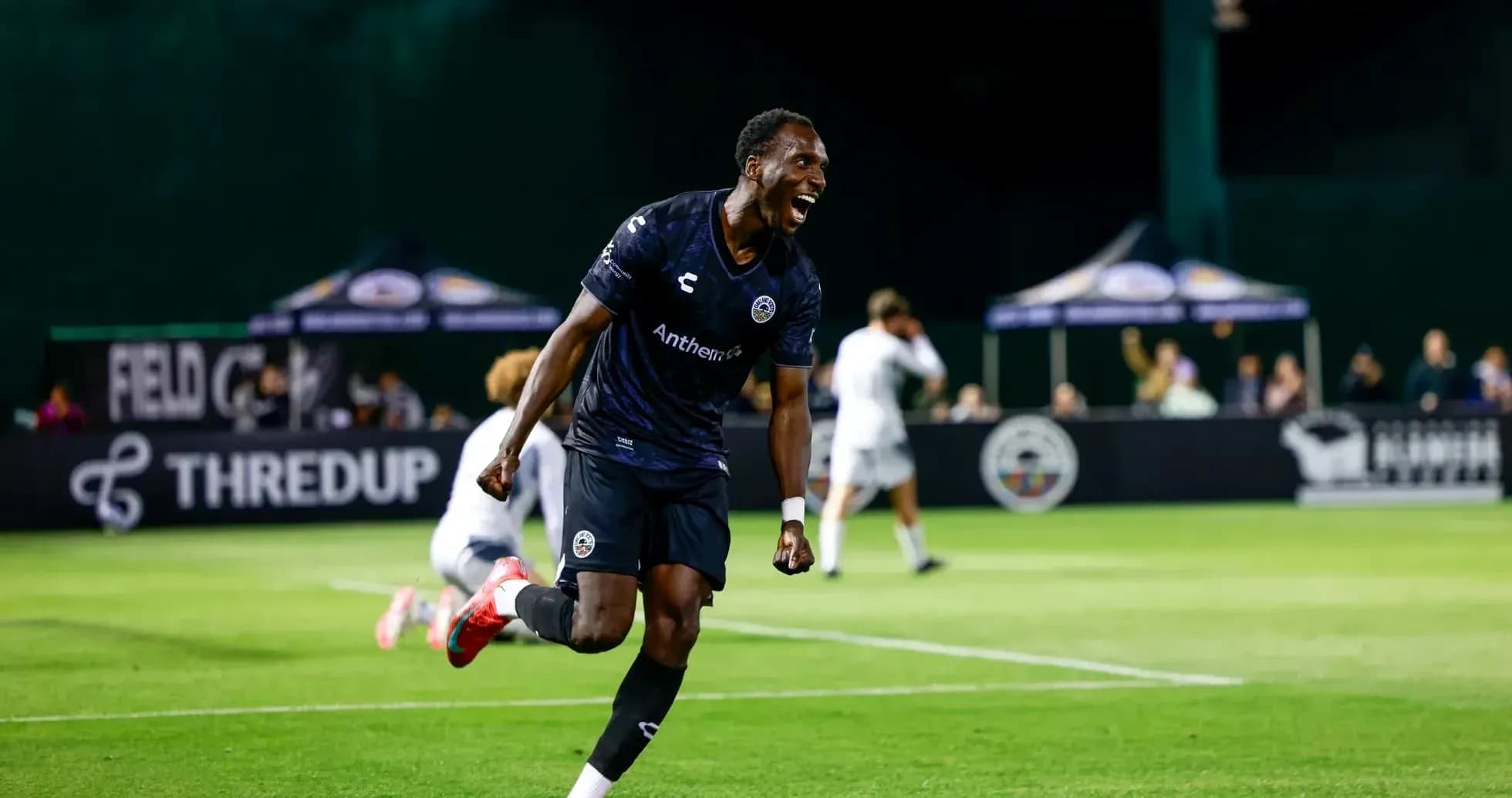 Player celebrating a goal during Loudoun United match