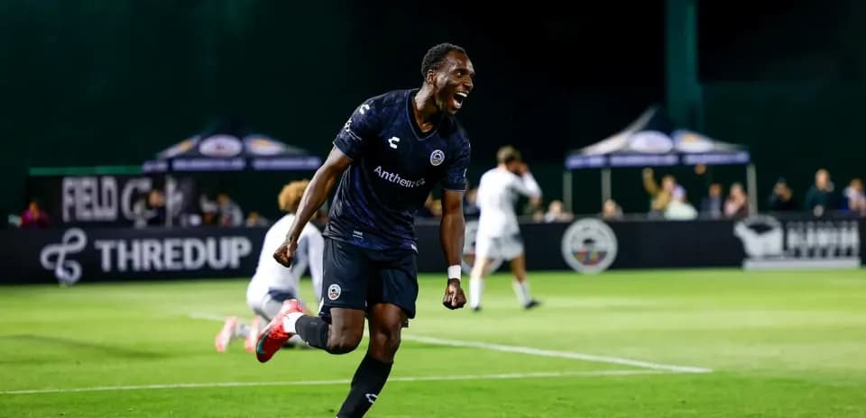 Player celebrating a goal during Loudoun United match
