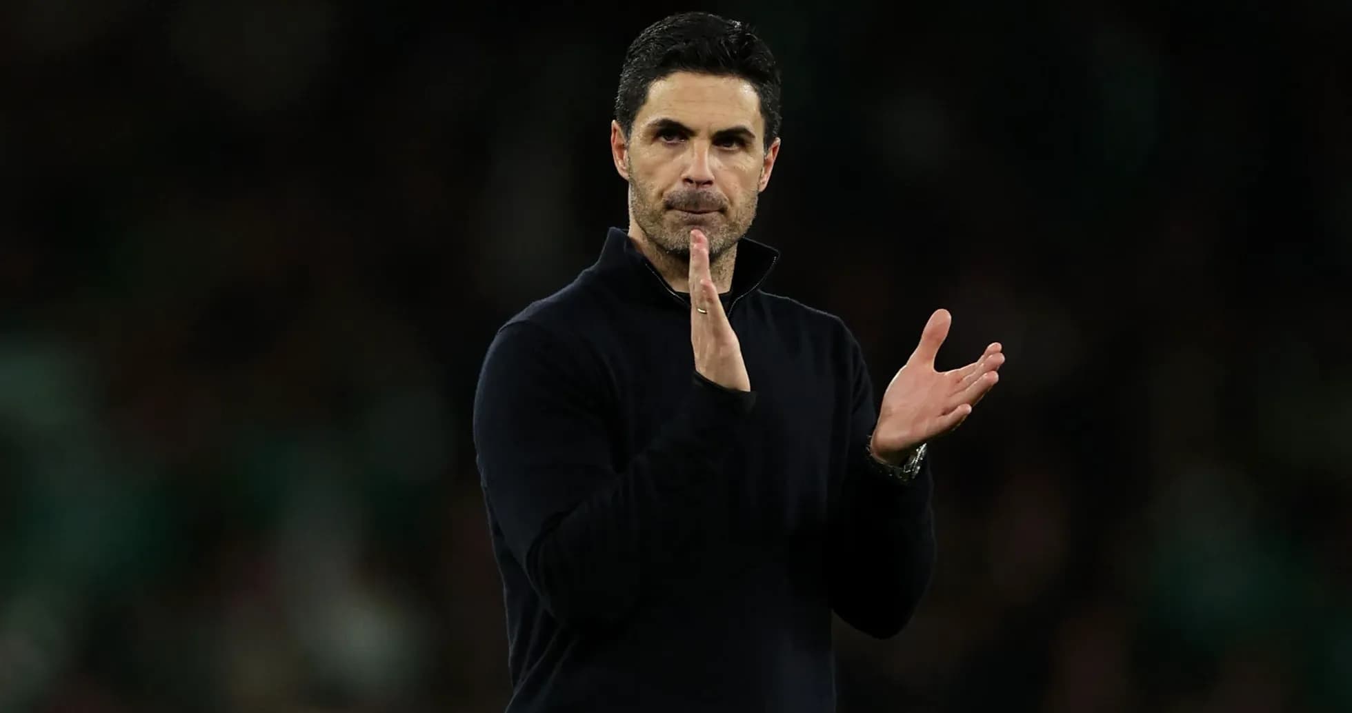 Manager applauding during a match