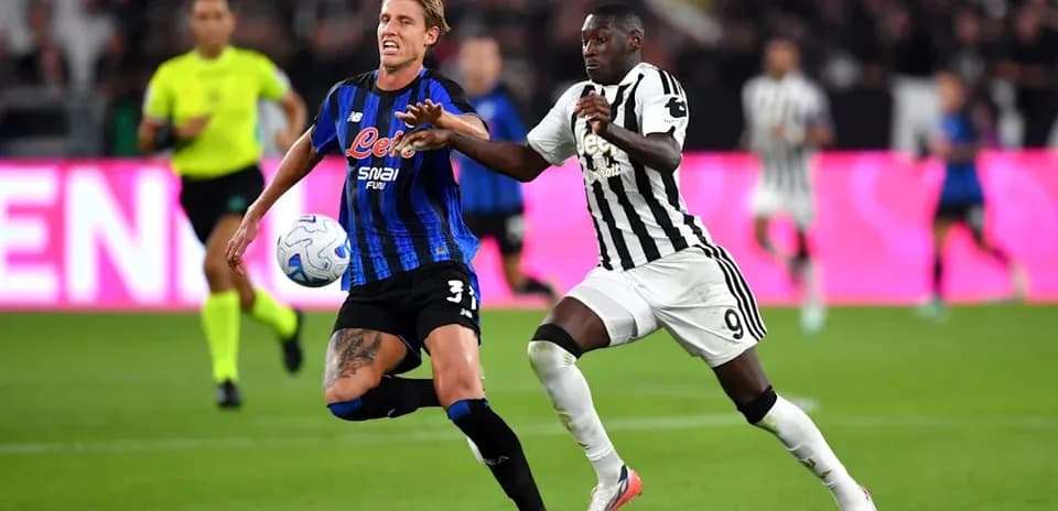 Two players battling for the ball during match
