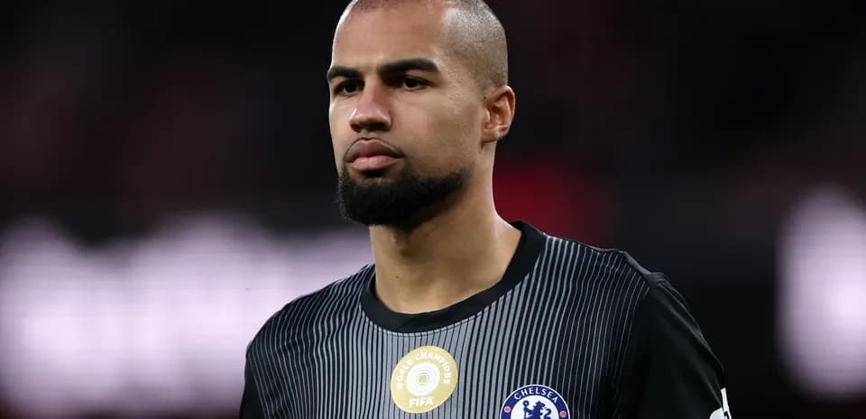 Player in Chelsea kit during match preparation