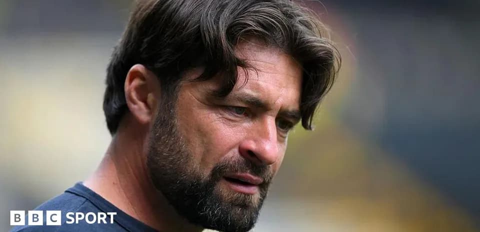 Coach looking thoughtful during a match