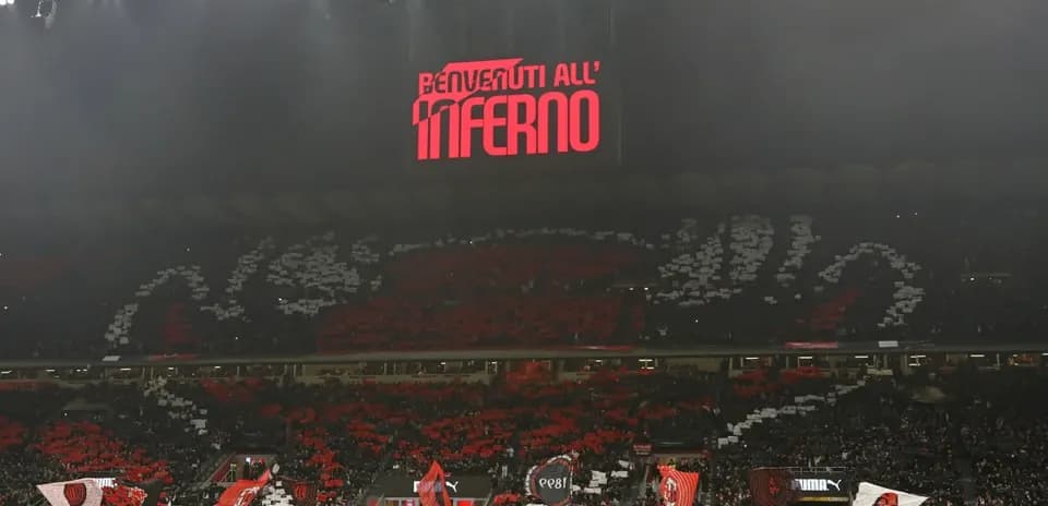 Fans displaying banners and flags in stadium