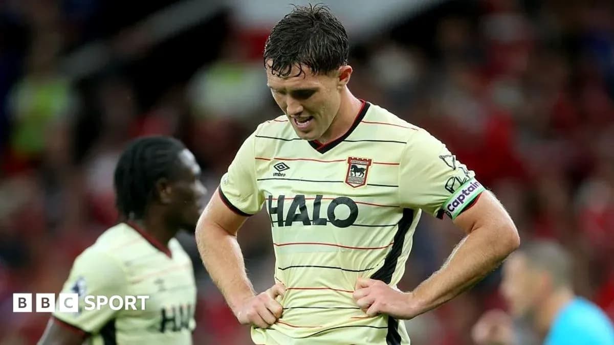 Player looking down in disappointment on the field
