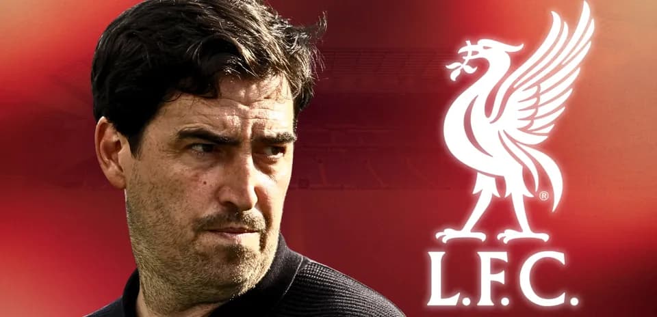 Man looking towards Liverpool FC logo background