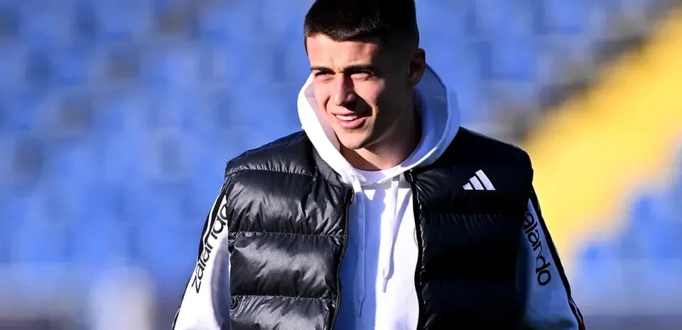 Player wearing a puffer vest at training ground